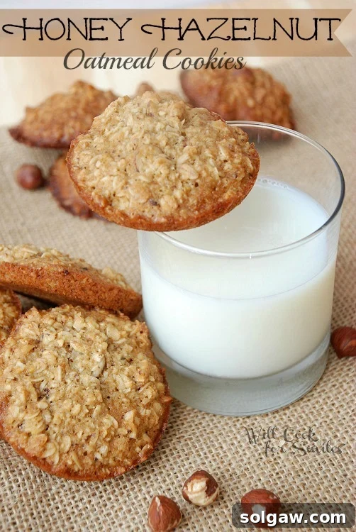 Soft and chewy oatmeal cookies with honey and hazelnuts on burlap, with a glass of milk