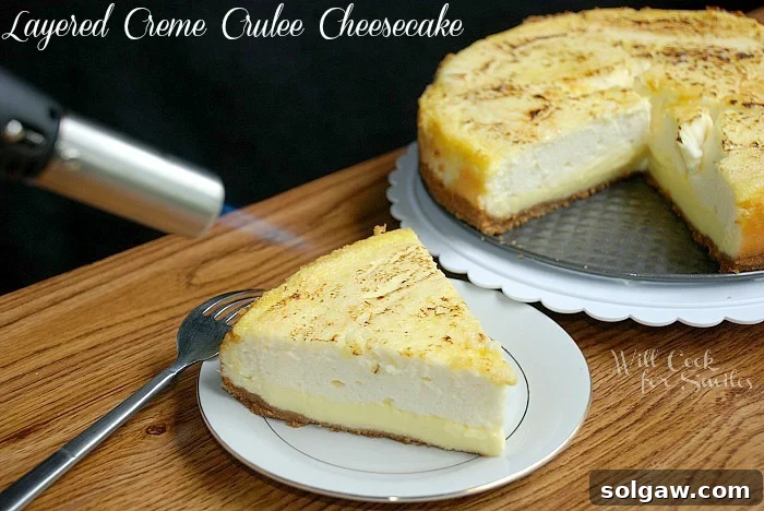 Using a cooking torch to perfectly caramelize the sugar topping on a slice of Crème Brûlée Layered Cheesecake, with the rest of the cake on a platter in the background.