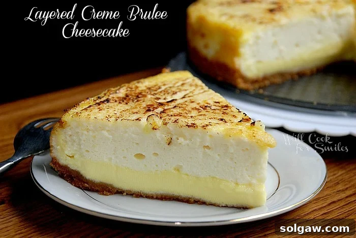 A perfectly sliced piece of Crème Brûlée Layered Cheesecake, showcasing the distinct layers of creamy cheesecake and golden Crème Brûlée custard, ready to be enjoyed.