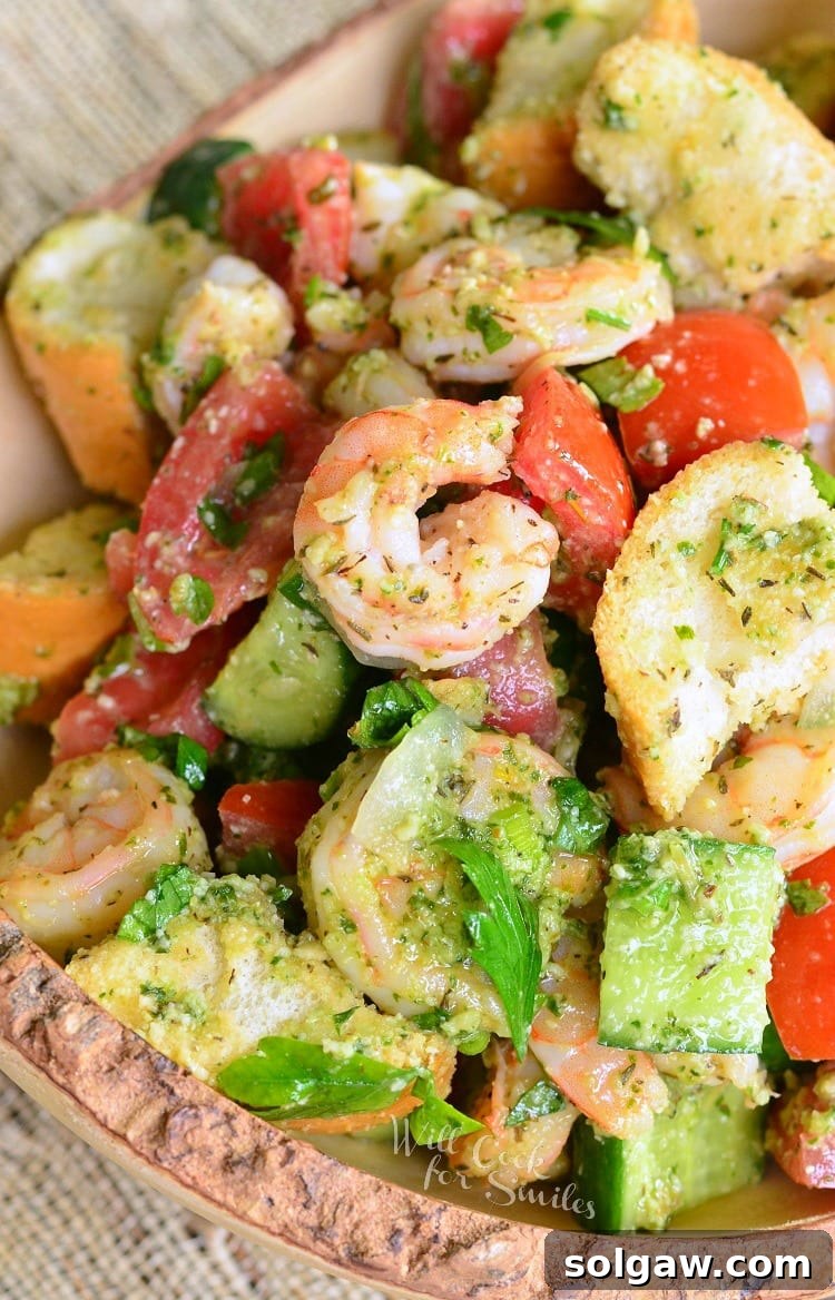 Panzanella Salad with Shrimp and Pesto. A twist on a Tuscan classic summer salad made with fresh veggies, pieces of Italian bread, shrimp and fresh pesto.