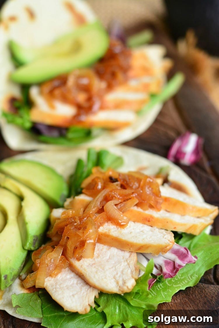 Sweet and Spicy Tequila Chicken Tacos: An unforgettable culinary experience featuring tender chicken marinated in a vibrant tequila-infused sauce, served in soft tortillas with fresh toppings.