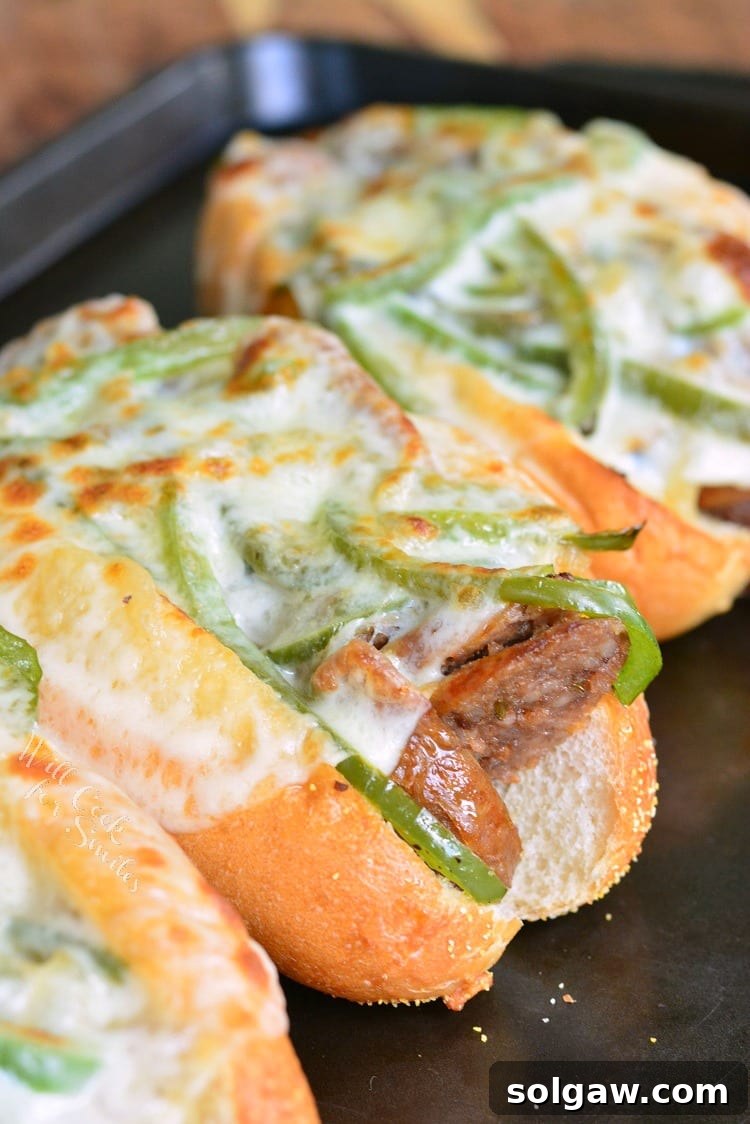 Philly Sausage Cheesesteak Hoagies 2 Philly Cheese "Steak" Sausage Hoagies on a baking dish