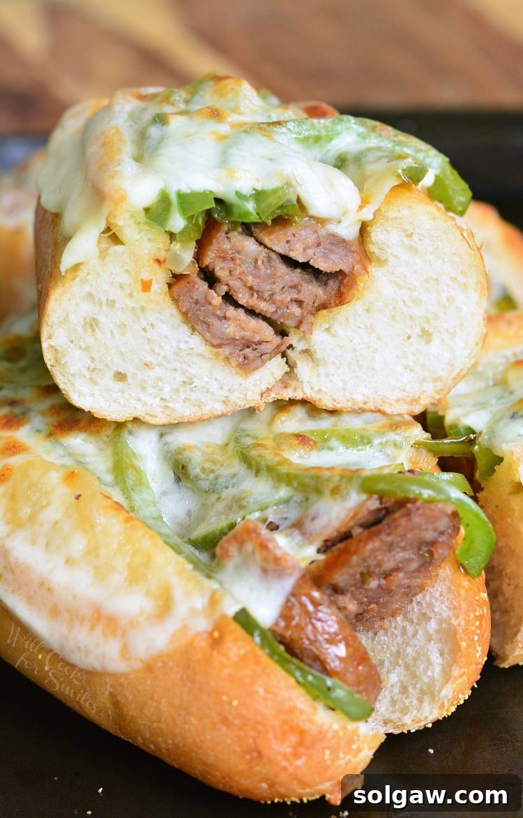 Philly Sausage Cheesesteak Hoagies 3 Philly Cheese "Steak" Sausage Hoagies stacked up on a baking dish