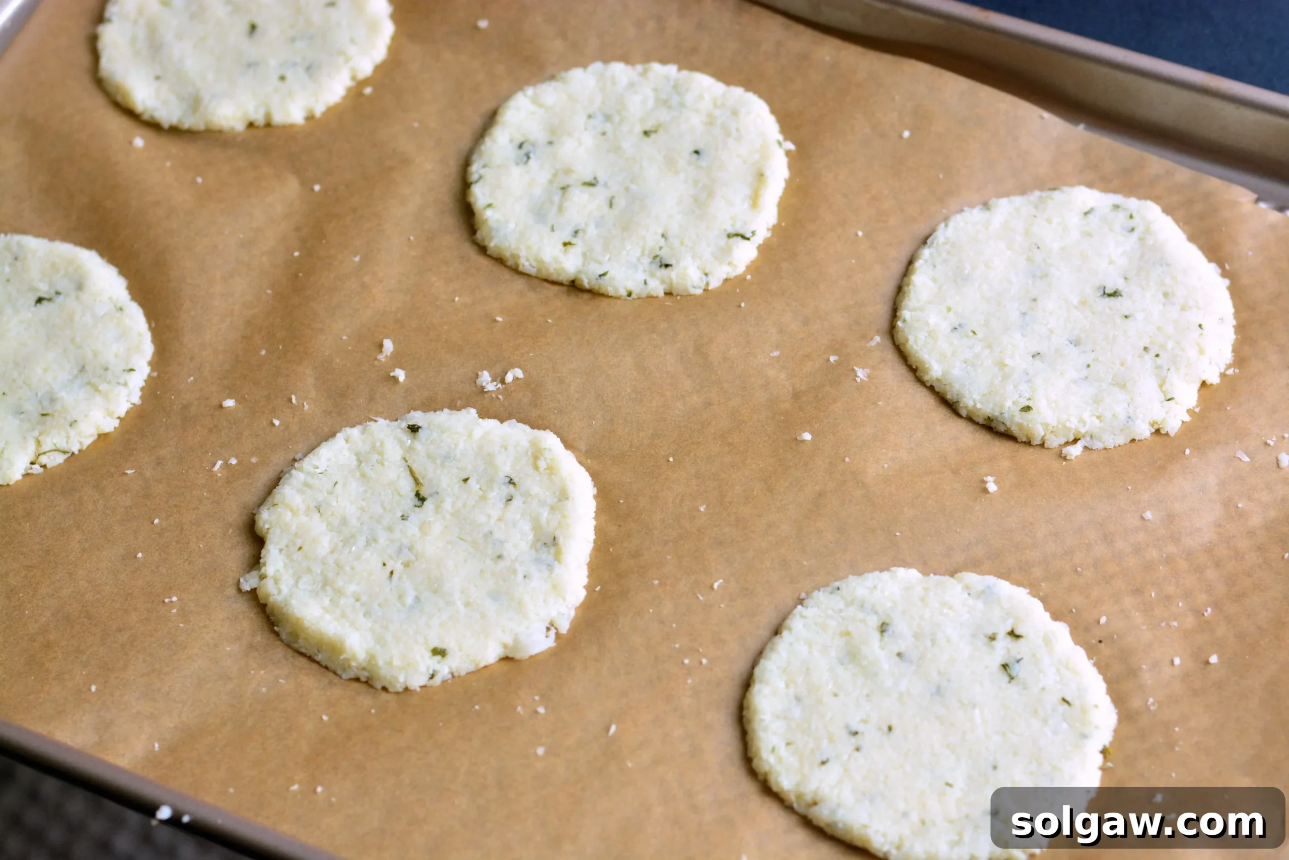 Cauliflower florets prepared for making crisps, emphasizing the fresh ingredients.