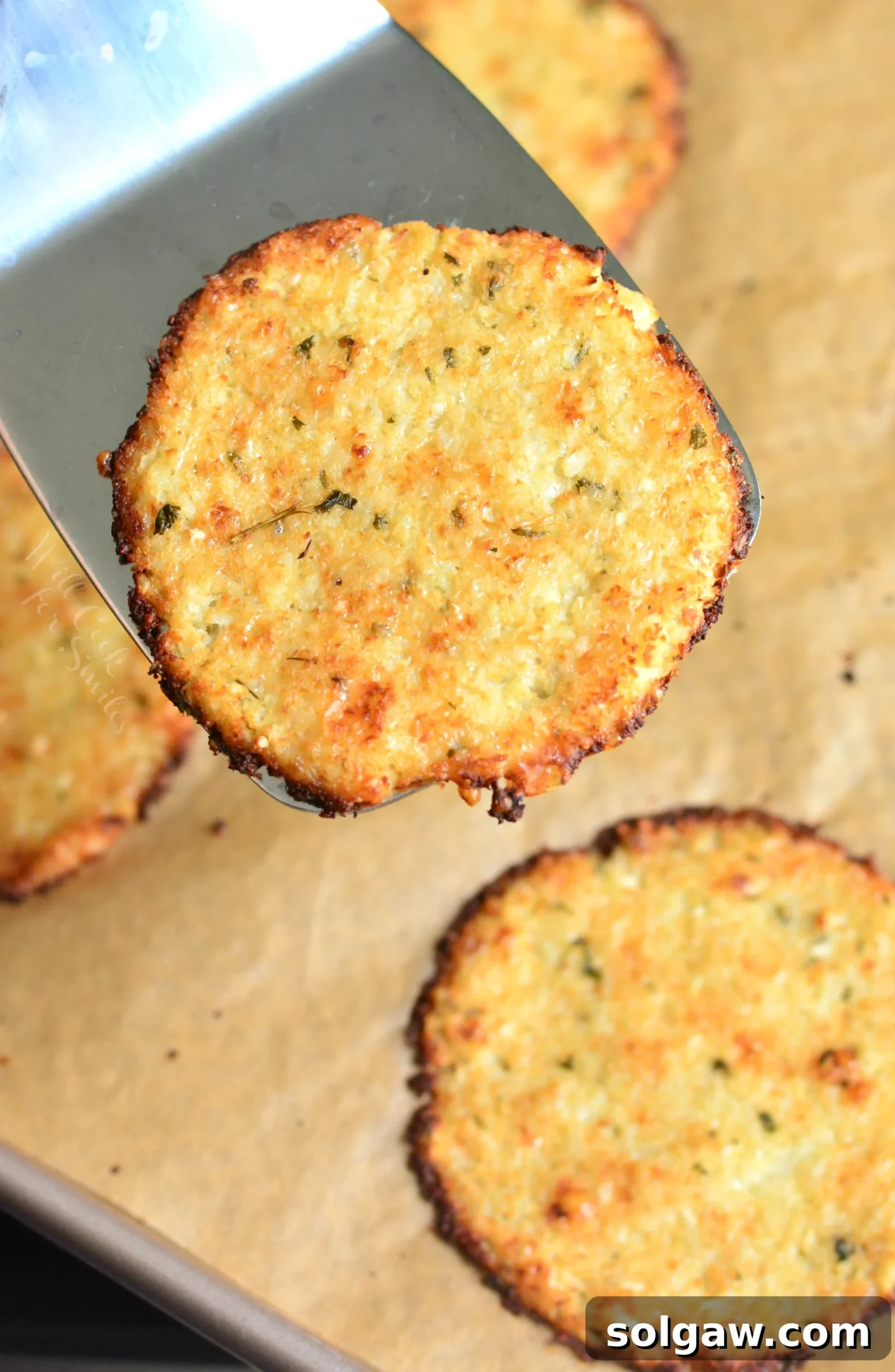 A stack of golden, savory Cauliflower Parmesan Crisps ready to be served, a perfect low-carb appetizer.