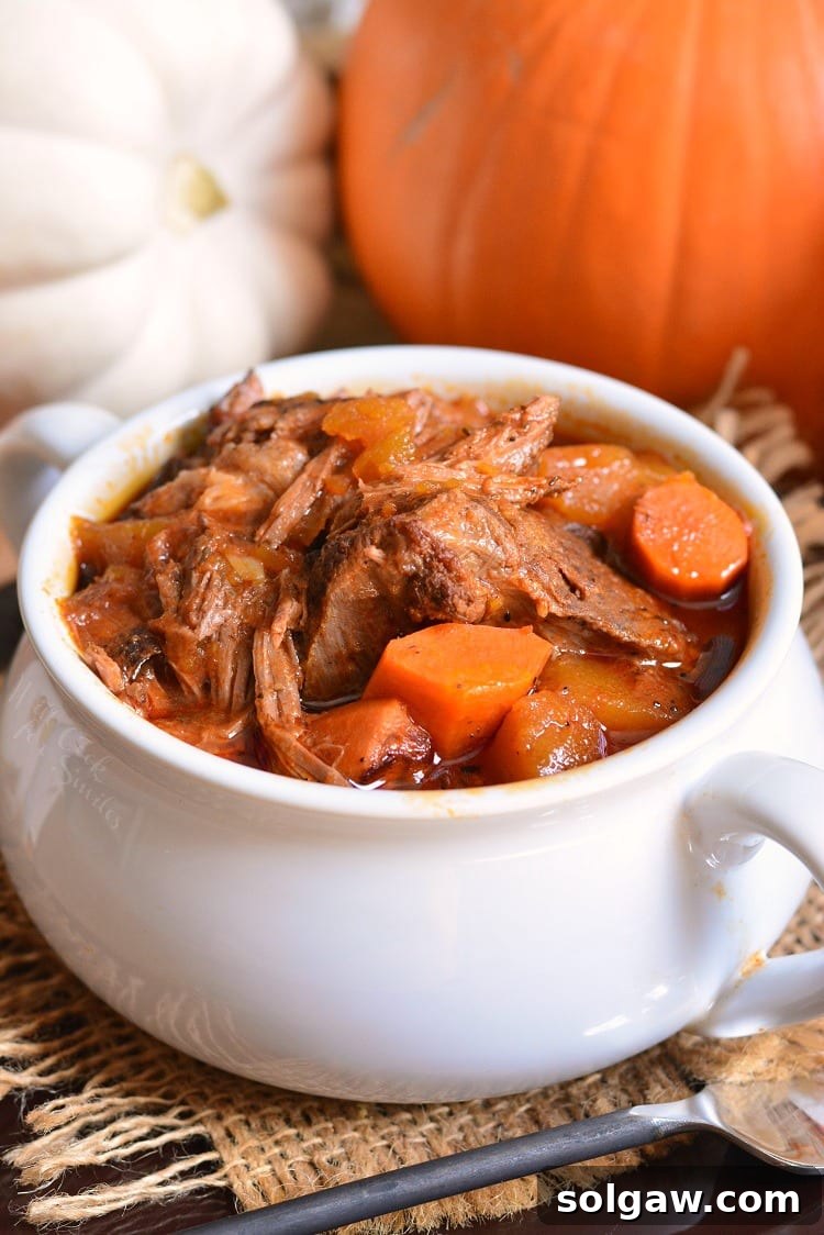 Crock Pot Roast Recipe in a bowl with pumpkins in the background