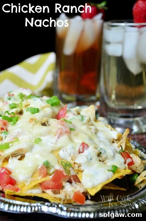 Delicious Chicken Ranch nachos on a sleek metal platter, ready to be served and enjoyed by friends and family.