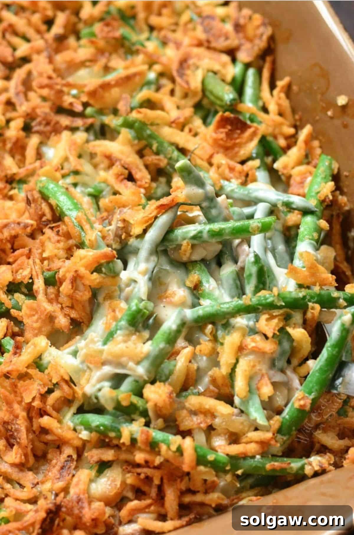 A delectable homemade green bean casserole in a baking dish, ready to be served.