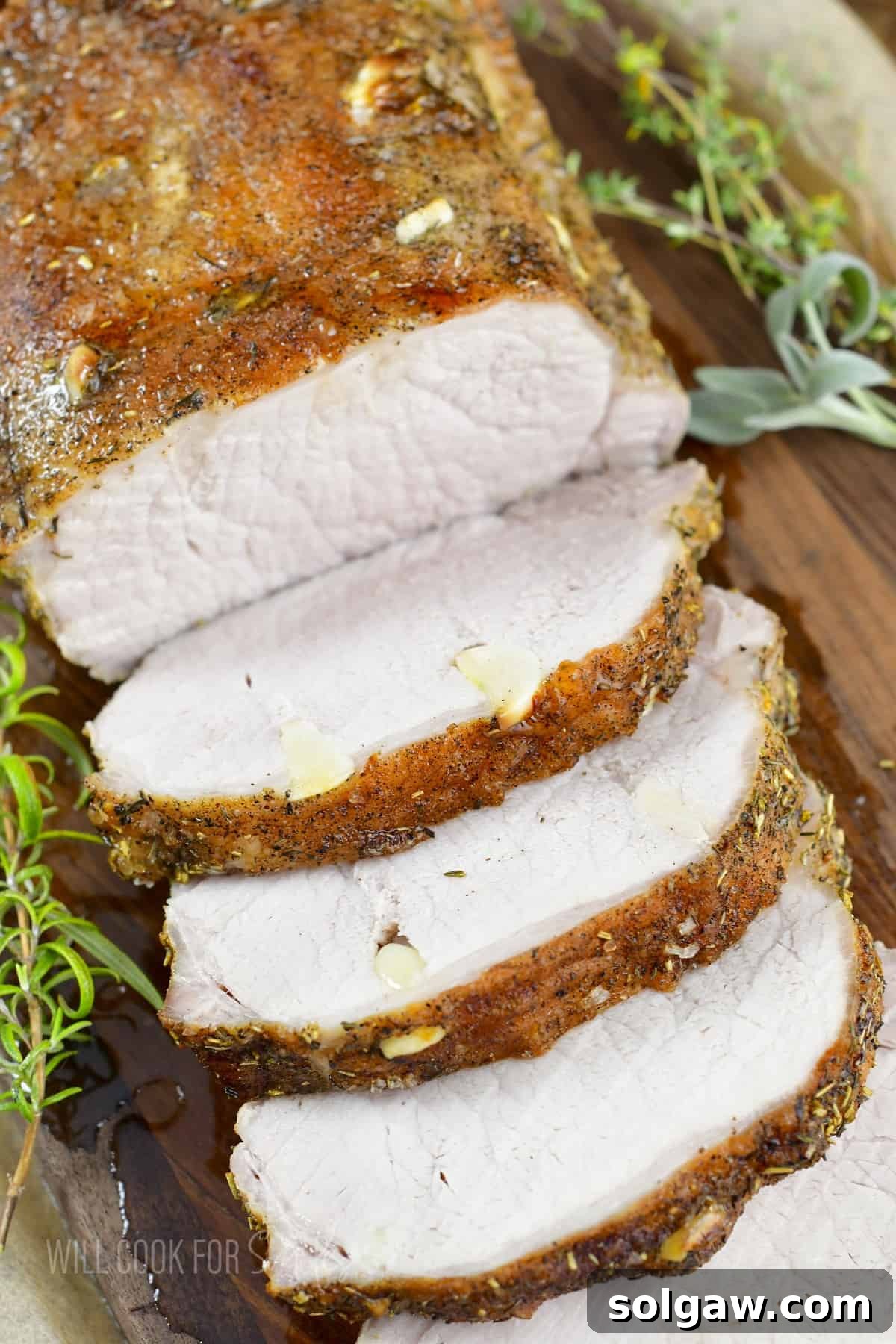 top view of roasted garlic pork loin on the board.