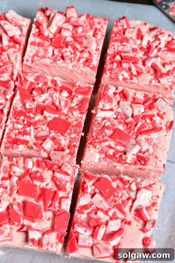 Peppermint White Chocolate Fudge resting on wax paper