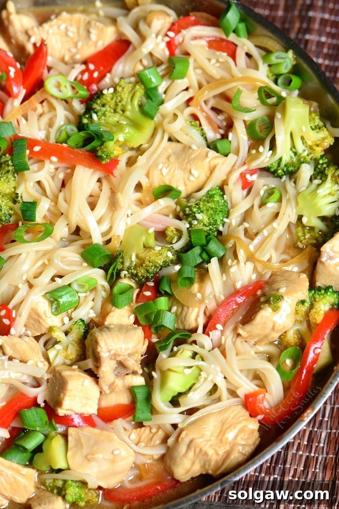 Sesame Chicken with Noodles in a pan 