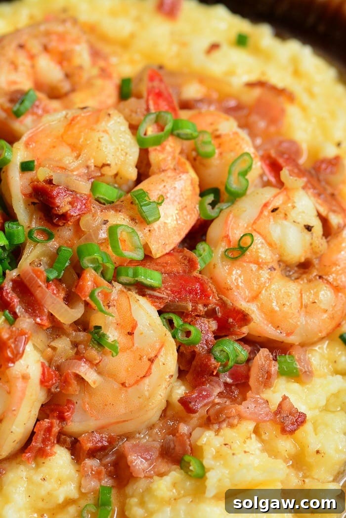 Southern Comfort Shrimp and Grits 8 Shrimp and grits close up photo with bacon and green onions.