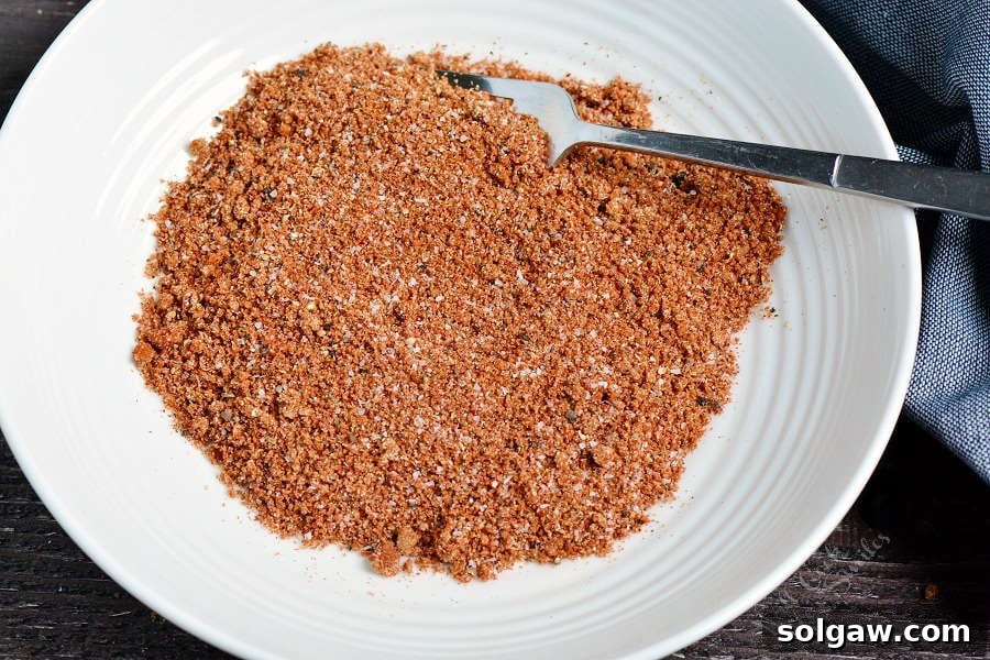 dry rub mixed up in a bowl with a fork