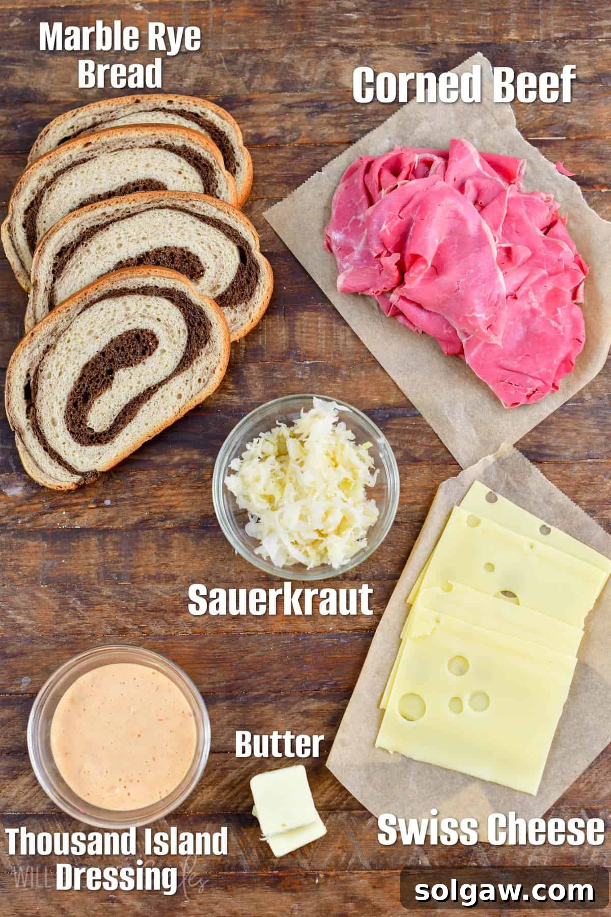 All the fresh ingredients for making a delicious Reuben sandwich laid out on a table.