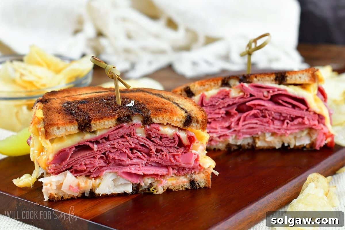 A freshly cooked Reuben sandwich, cut in half and held together with toothpicks, ready to be enjoyed.