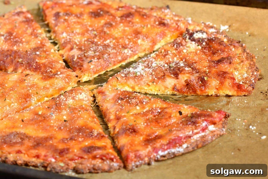 Cauliflower Pizza Crust cheese pizza on parchment paper