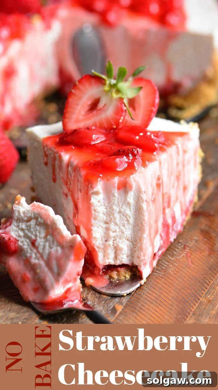Deliciously creamy No-Bake Strawberry Cheesecake slice on a wooden board