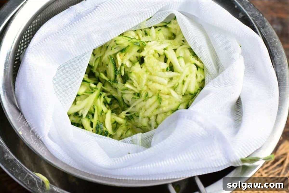 Crispy Zucchini Fritters 4 shaved zucchini in a mesh bag over the mixing bowl.