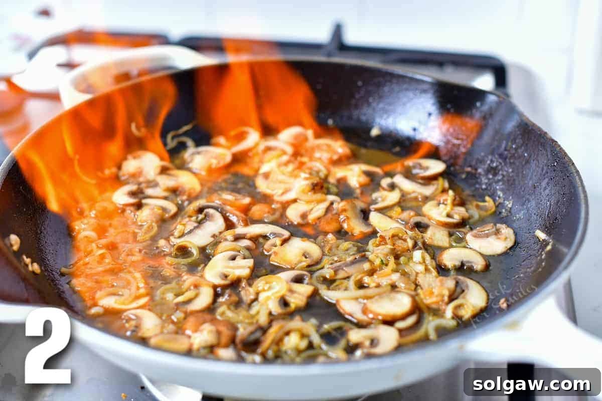 flambe technique: cognac set on fire in the skillet with mushrooms.