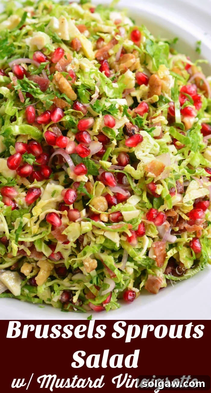 A vibrant Brussels sprouts salad in a beautifully crafted serving bowl, showcasing shaved sprouts, pomegranate seeds, pecans, and bacon, ready to be enjoyed as a perfect winter side dish.