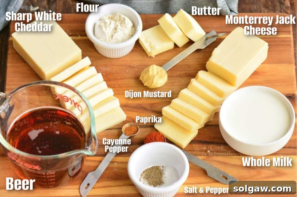 labeled ingredients to make beer cheese dip on a wooden cutting board.