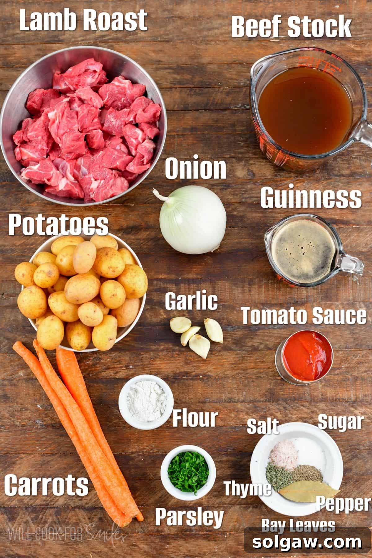 Labeled ingredients for Irish beef strew on a wood surface.