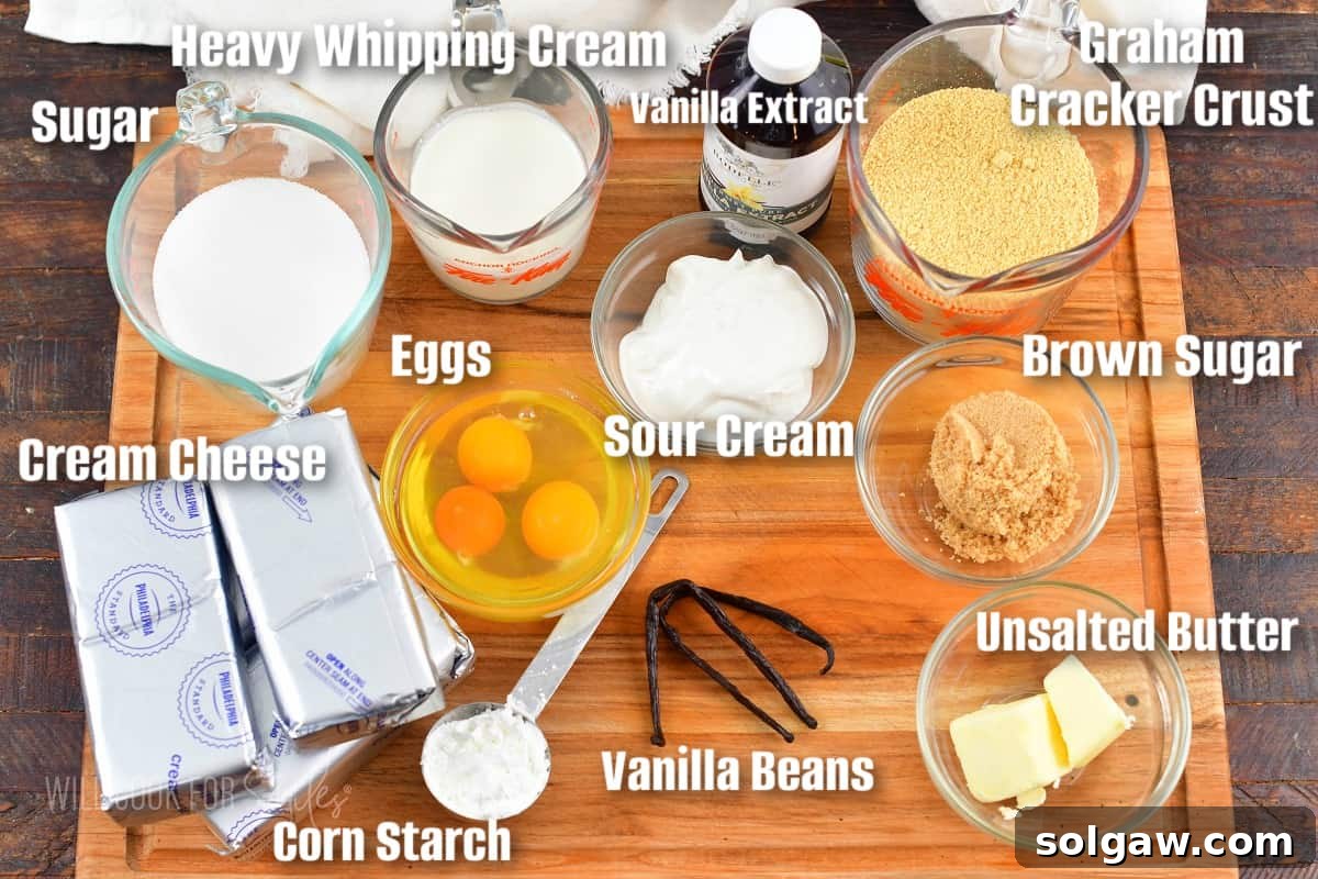labeled ingredients to make vanilla bean cheesecake on the cutting board.