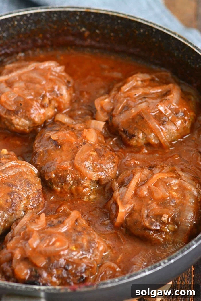 French Onion Salisbury Steak on mashed potatoes.