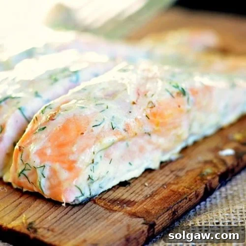 Fresh salmon grilled on a cedar plank, generously coated with a creamy lemon dill sauce.