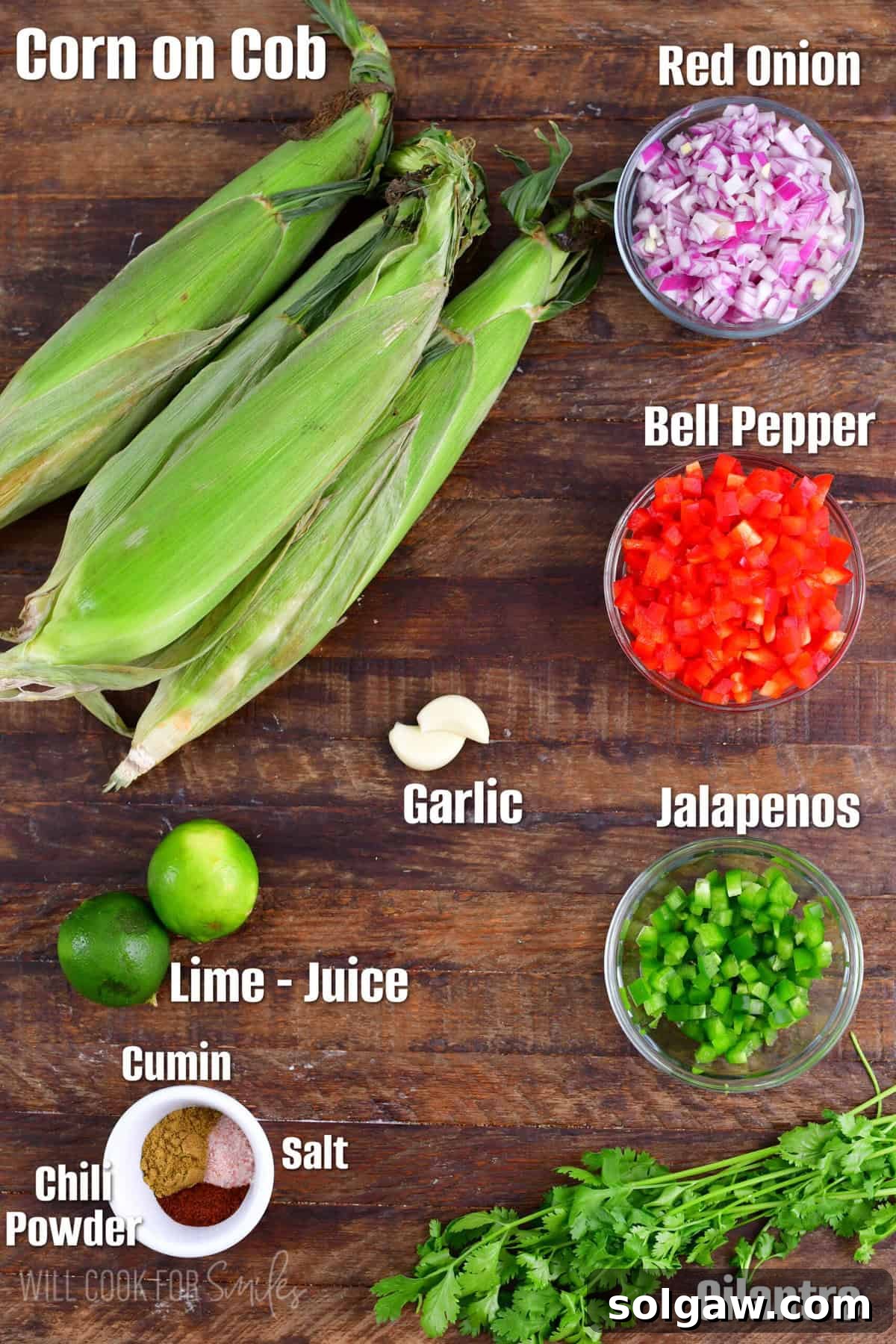 Labeled ingredients for corn salsa laid out neatly on a rustic wood surface, highlighting their freshness.