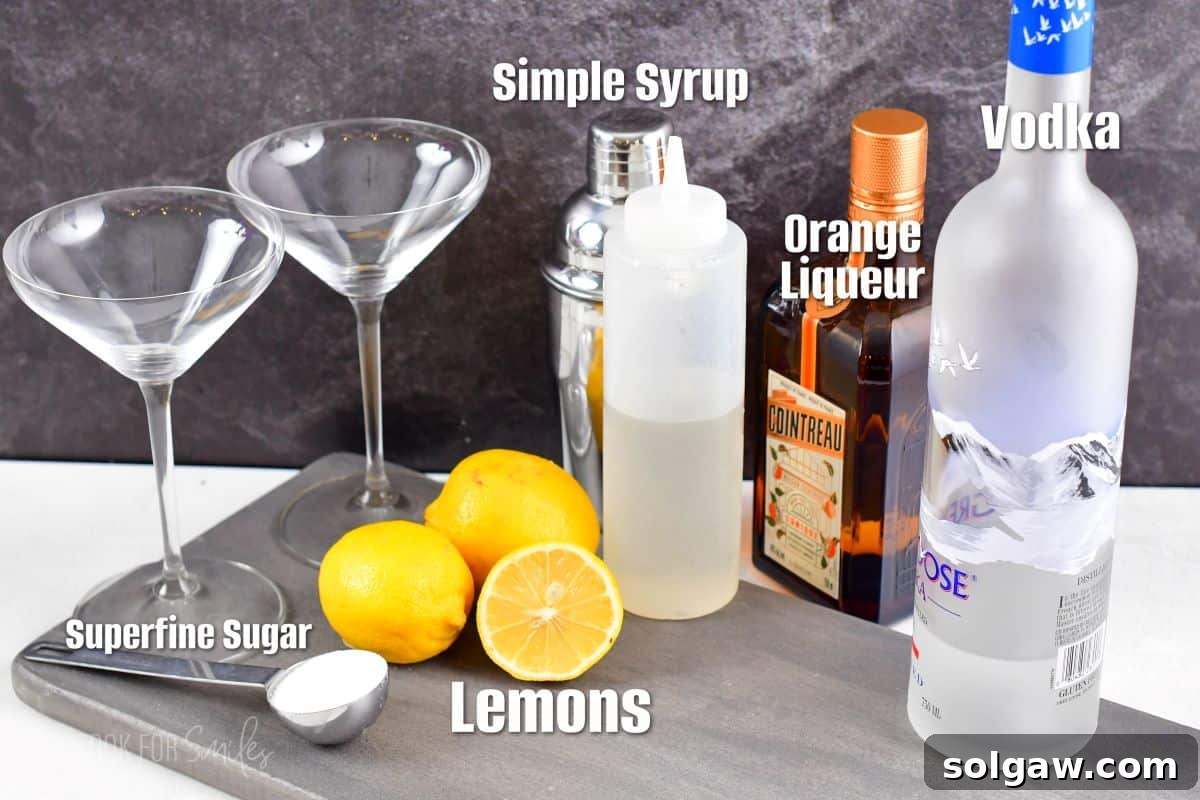 Ingredients for lemon drop martini on a gray piece of wood.