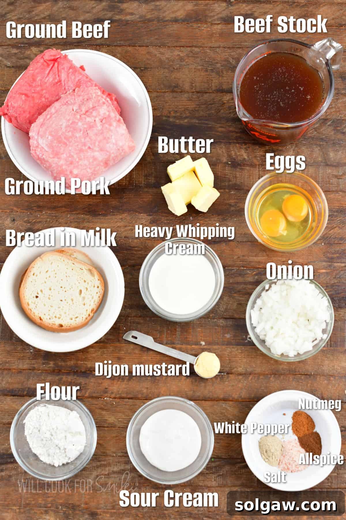 Creamy Swedish Meatballs 3 All the fresh ingredients required to make authentic Swedish meatballs are neatly arranged on a rustic wooden surface, highlighting their quality.