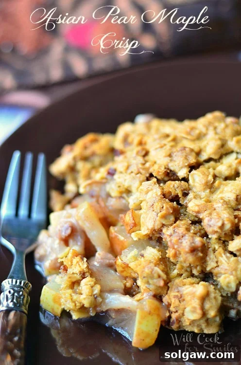 A warm, bubbly Asian Pear Maple Crisp fresh from the oven, showcasing its irresistible golden crust.