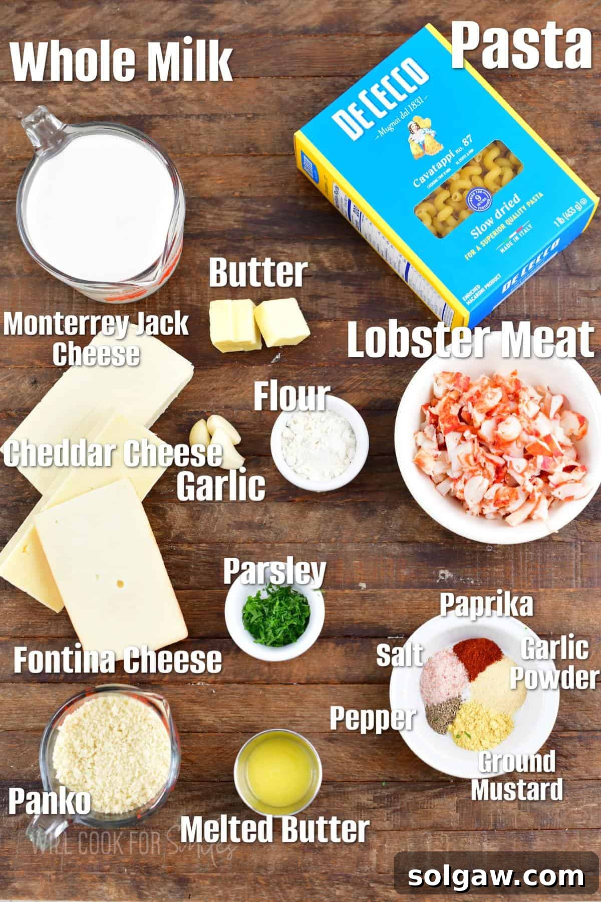 Gourmet Lobster Mac 3 Labeled ingredients laid out on a wooden board for making homemade lobster mac and cheese.