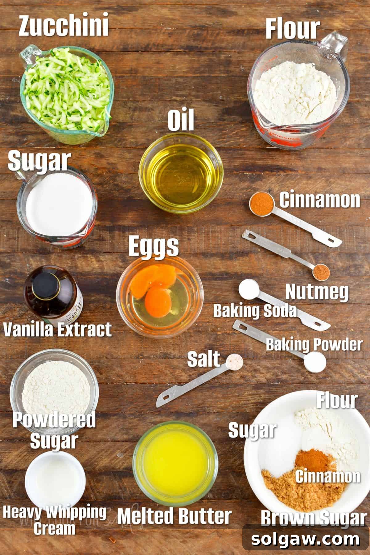 Zucchini Loaf Perfection 3 All the fresh ingredients for baking homemade zucchini bread laid out on a clean wooden surface, ready for preparation.