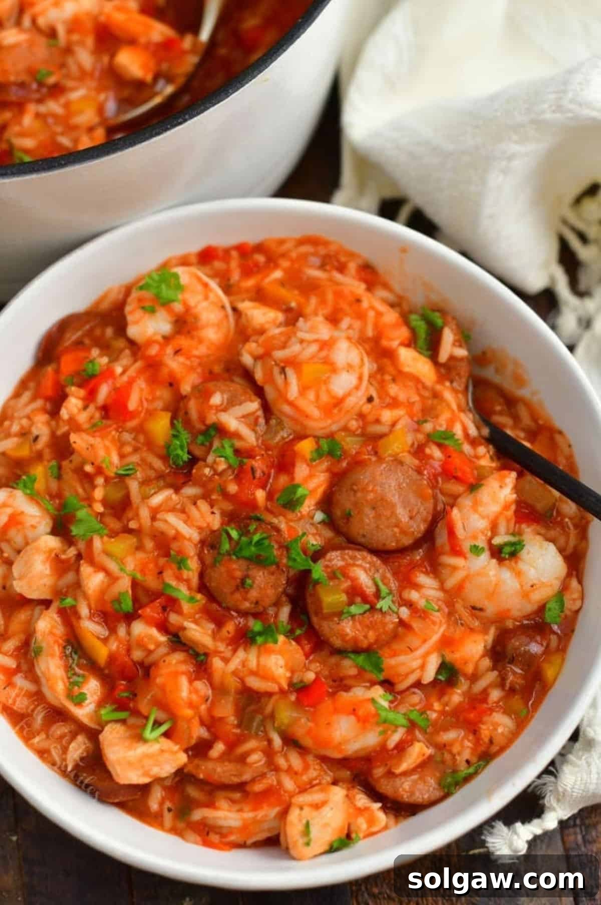 A vibrant bowl of Jambalaya, showcasing a hearty mix of shrimp, chicken, and sausage, perfectly seasoned and ready to enjoy.