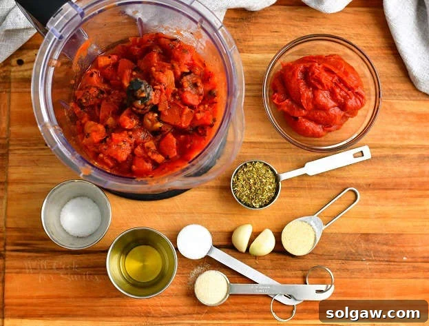 overhead: ingredients in bowls and measuring spoons to make homemade pizza sauce recipe