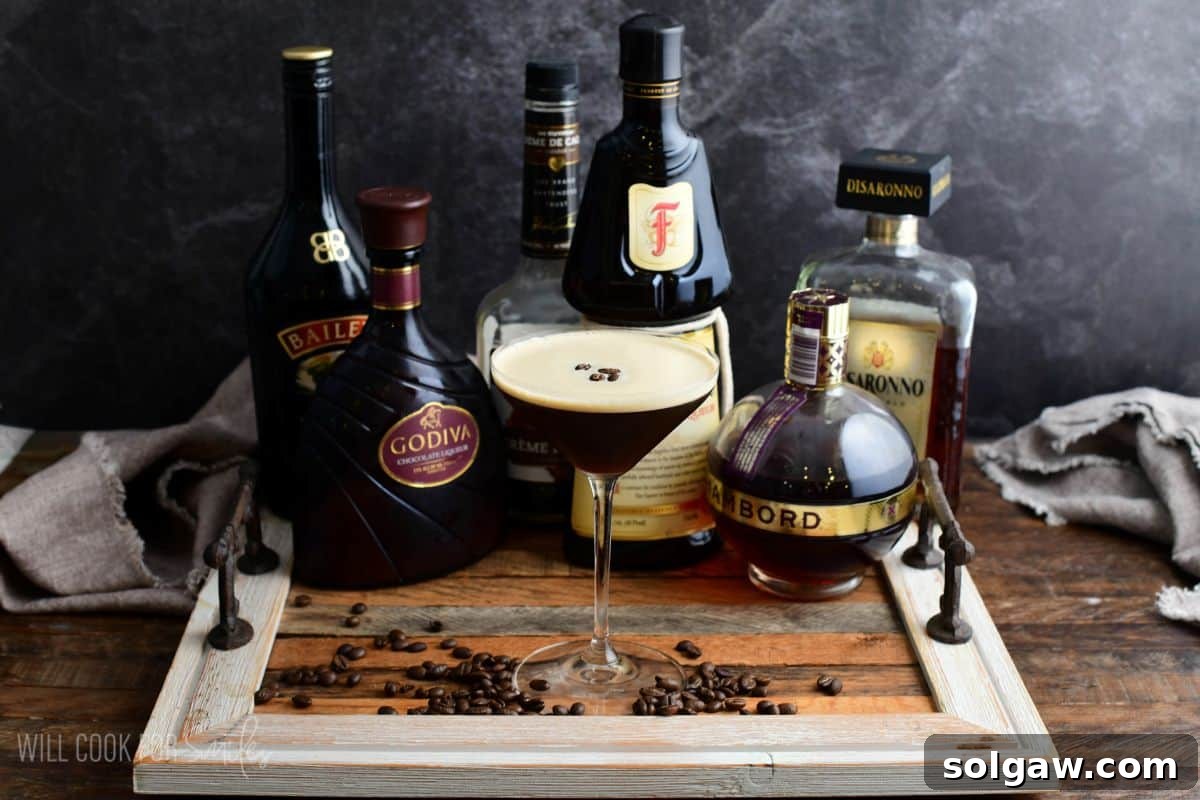 A selection of espresso martinis, each with a different colored liqueur in a small glass next to it, on a wooden tray, showcasing various flavor options.