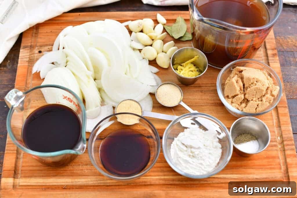 A curated collection of ingredients, including chopped onions, garlic, various liquids, and spices, arranged on a cutting board and in measuring cups, ready for preparing the oven roasted brisket recipe.