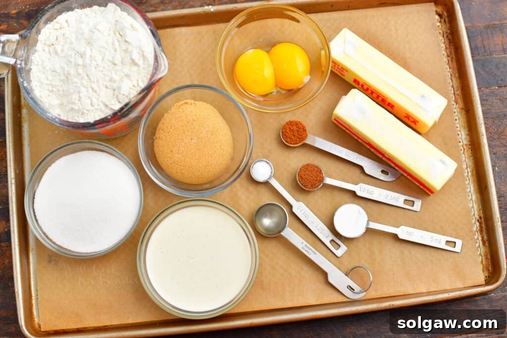 A collection of eggnog cookie recipe ingredients laid out on a baking sheet, ready for preparation.