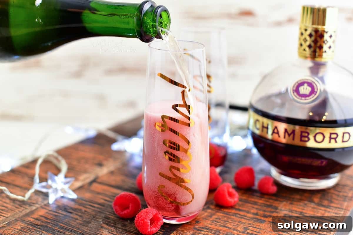 pouring champagne into tall glass champagne flute