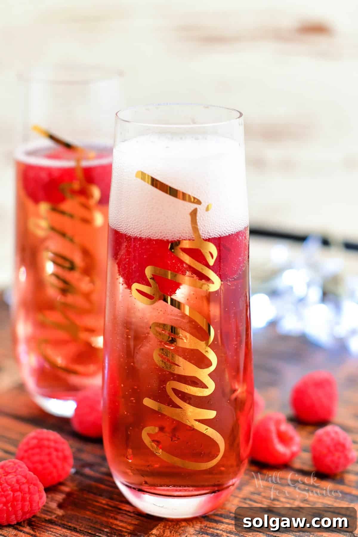 festive pink cocktail in tall glass