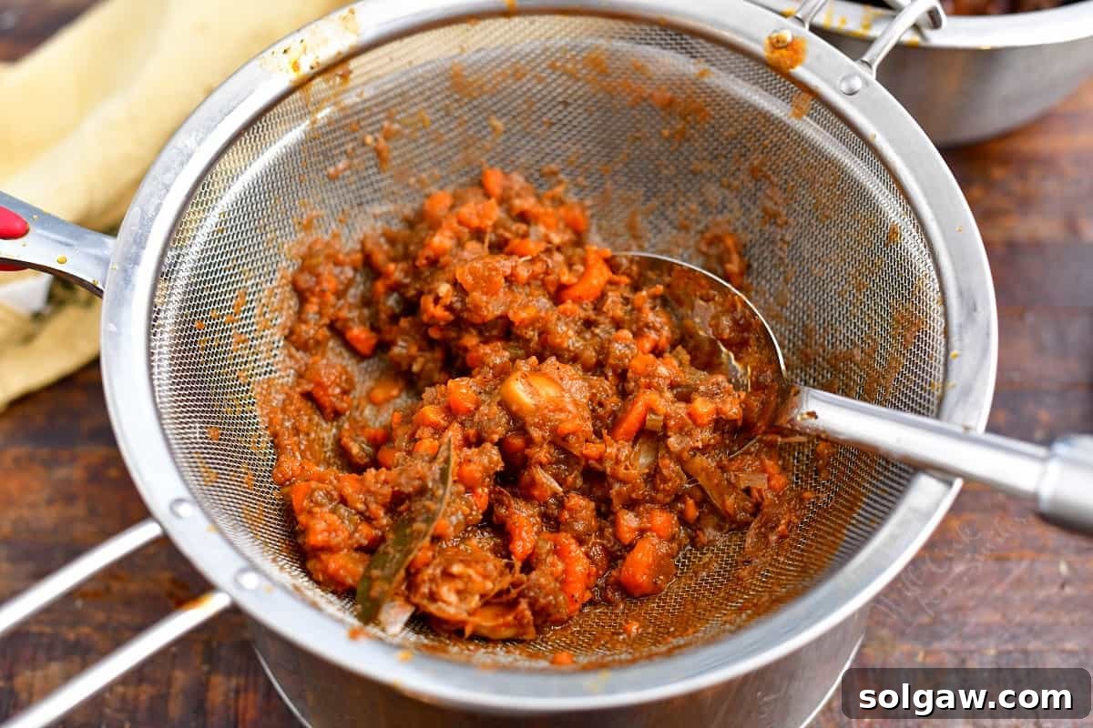 straining liquids through mesh strainer for beef short ribs recipe