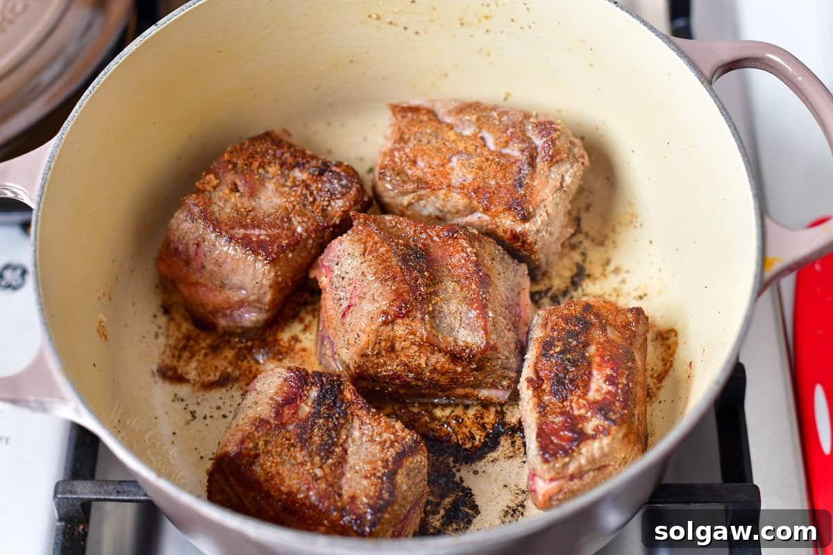 braised beef in large Dutch oven on stove top