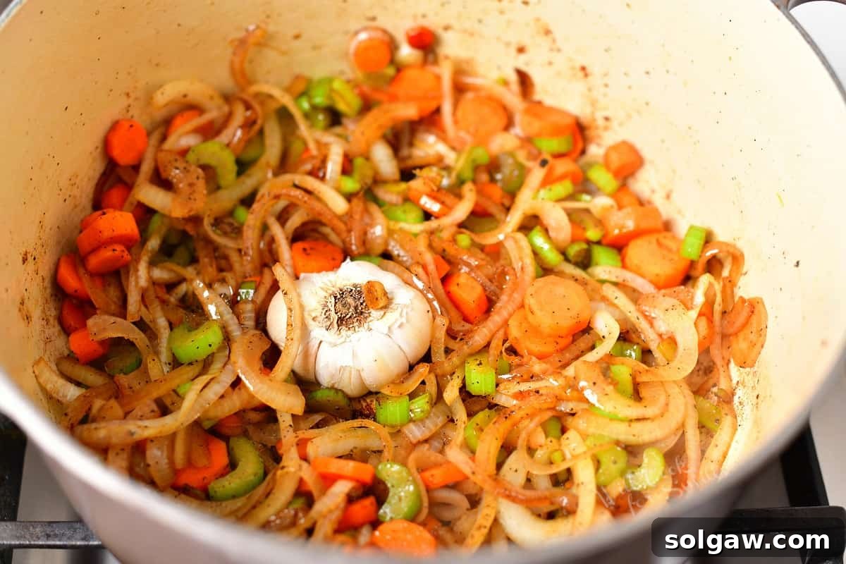 cooked mirepoix in a Dutch oven