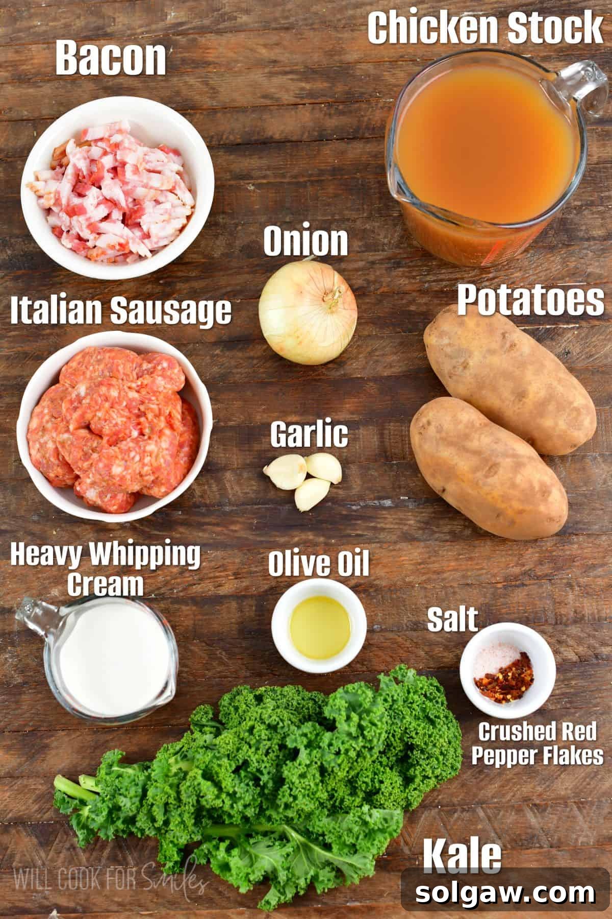 Labeled ingredients for Zuppa Toscana soup neatly arranged on a rustic wood surface.