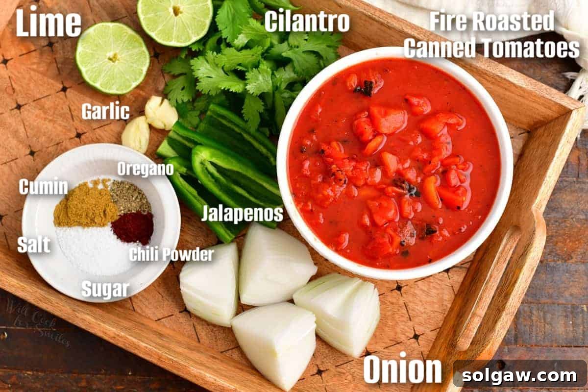 Labeled ingredients for making restaurant-style salsa displayed on a wooden tray, including tomatoes, onions, jalapenos, and cilantro.