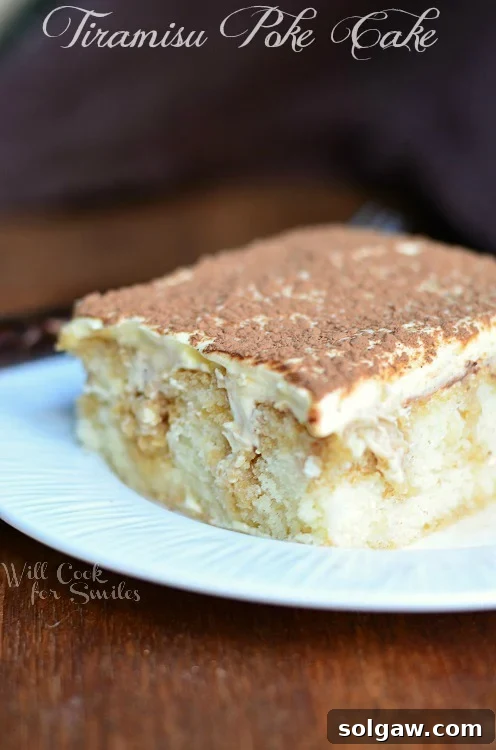 Espresso Infused Tiramisu Poke Cake 5 Tiramisu Poke Cake slice on a white plate