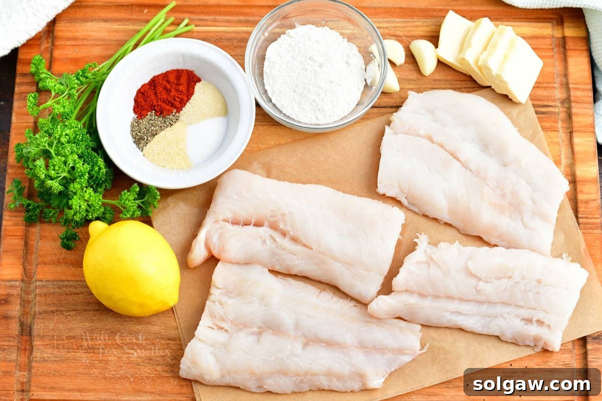 The ingredients for baked cod are placed on a wooden cutting board.