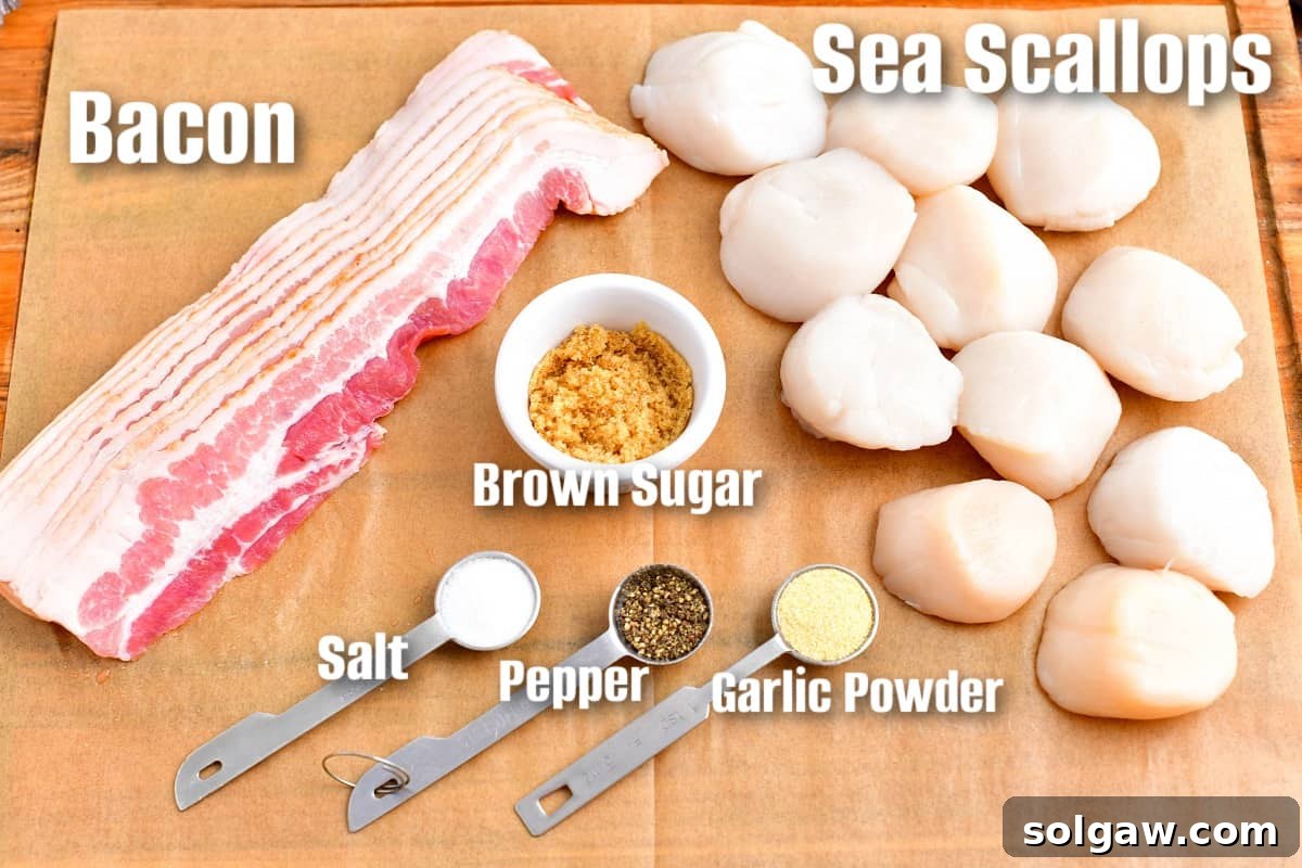Labeled ingredients including sea scallops, bacon, garlic powder, brown sugar, salt, and pepper laid out on parchment paper for making bacon wrapped scallops.
